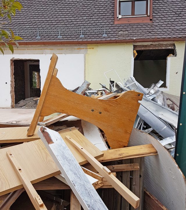 old house being demolished, heaps of old inventory, detail shot